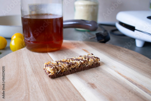 Granola Bar with Chocolate and Honey Jar in Kitchen