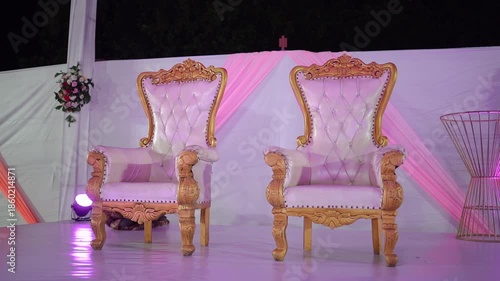 Beautifully decorated wedding venue featuring elegant floral arrangements, soft ambient lighting, and luxurious table settings