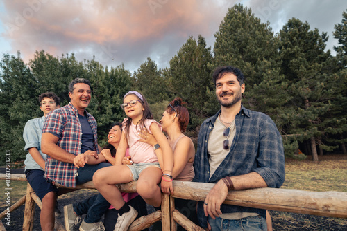 фотографія Friends sitting together outdoors enjoying time in nature