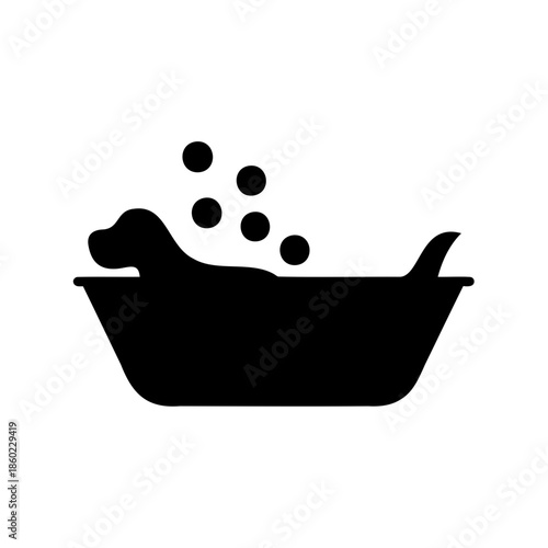 A cute dog is taking a bubble bath in a tub