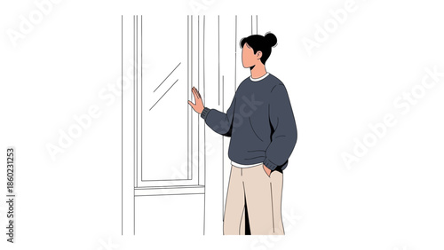 Young woman looking out a window in casual clothing and contemplating the view