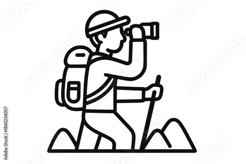 Hiker looking through binoculars on a mountain