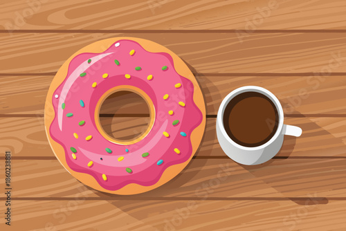 Donut with pink frosting and sprinkles next to a cup of coffee on wooden table