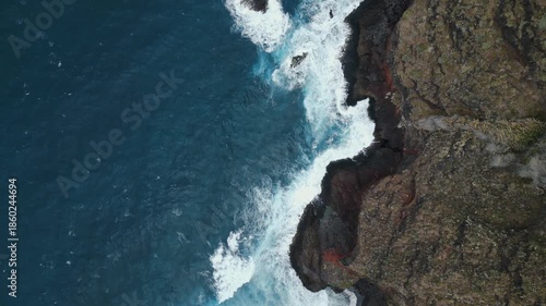 Drone footage flying above rugged volcanic cliffs on the northern coast of Tenerife, showcasing raw natural beauty and Atlantic views.