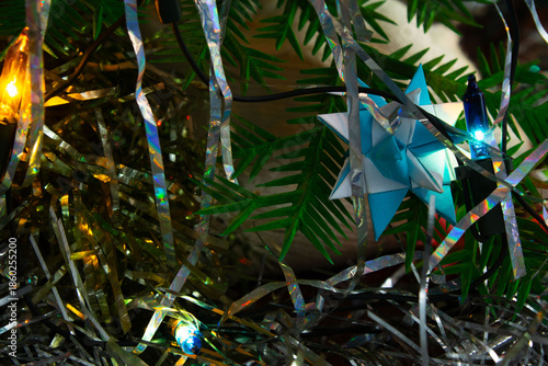 Origami Star Ornament on a Decorated Christmas Tree