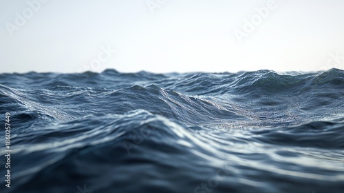 Serene Ocean Waves Gently Lapping Against the Shore with Sunlight Sparkling on Water Surface