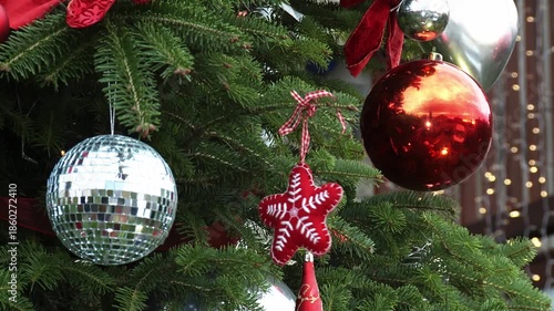 Christmas Ornaments Hanging on Decorated Christmas Tree