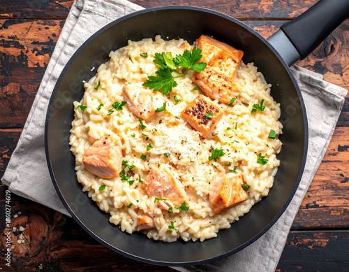 Creamy Salmon Risotto with Flaky Fish Served in Pan, Top View Food Photography