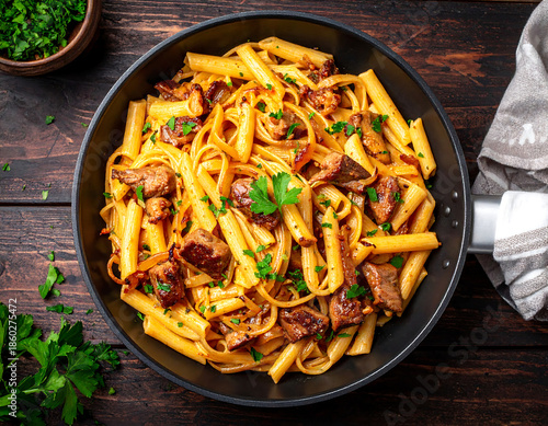 Creamy Pasta with Sautéed Meat and Caramelized Onions Served in Frying Pan, Top View Food Photography