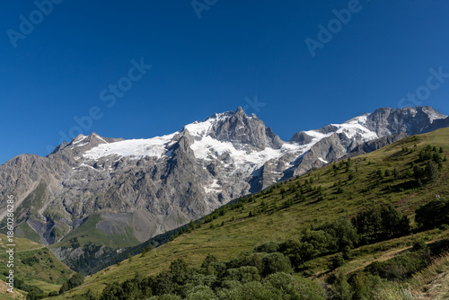 View of La Meije from the Emparis Plateau in the Arves Massif, Hautes-Alpes, France