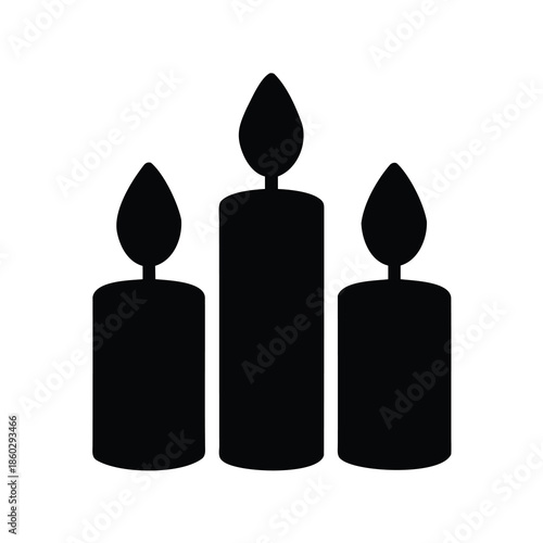 Three elegant candles illuminate the darkness, casting a soft, warm glow
