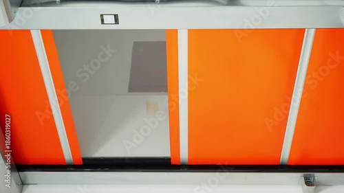 Motion sensor controlled automatic doors opening in a contemporary manufacturing plant highlighting industrial automation safety and modern workplace technology. High quality 4k footage