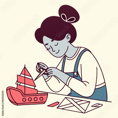 Girl crafts a paper boat and origami figures