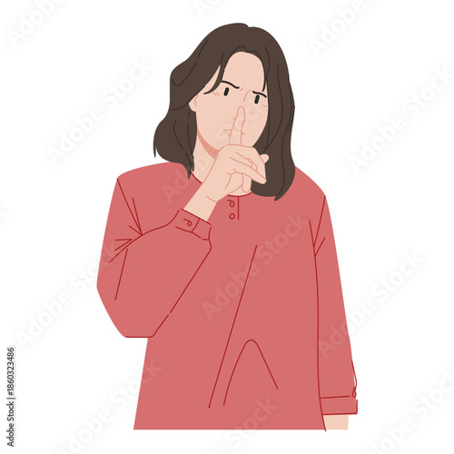 A woman makes a gesture to be quiet
