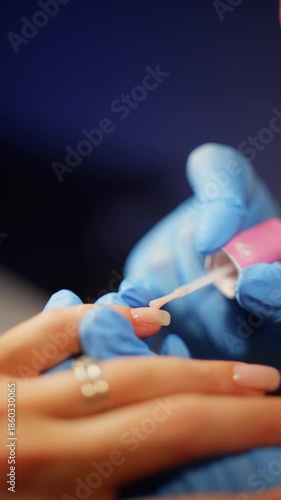 Close-up of applying gel base to the nail plate. High quality 4k footage