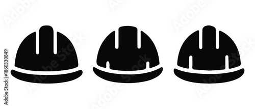 Black Hard Hats Lined Up Against White Background - Safety and Construction Concept.