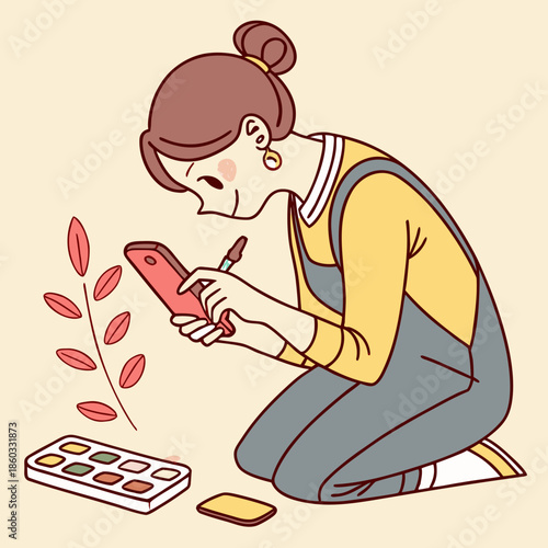 Woman drawing on phone with stylus and palette