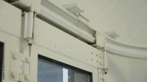 Modern automatic garage doors opening as part of smart home automation system representing future technology comfort and residential innovation. High quality 4k footage