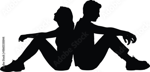 Silhouette of two people sitting together in a romantic embrace