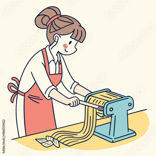 Woman making fresh pasta with a machine