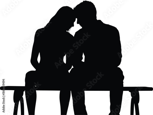 Silhouette of a romantic couple sitting together on a bench