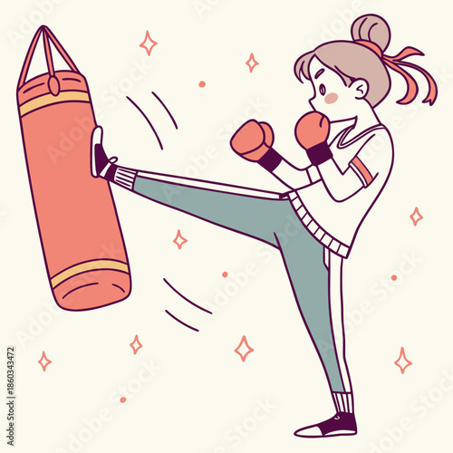Woman practicing kickboxing with punching bag