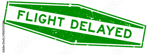 Grunge green flight delayed word hexagon rubber seal stamp on white background