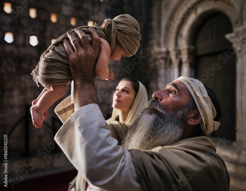 The Elder Simeon holds the Infant Jesus in his arms. Mary and Joseph stand nearby. Feast of the Presentation of the Lord.