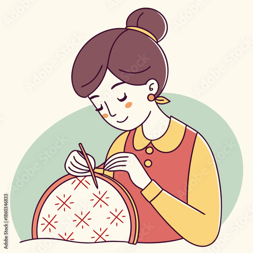 Woman sewing intricate embroidery pattern