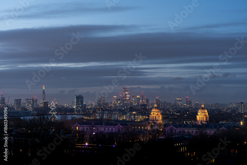City skyline at dusk with glowing lights