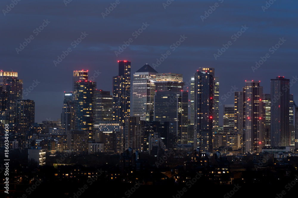 Fototapeta premium Nighttime cityscape with illuminated skyscrapers
