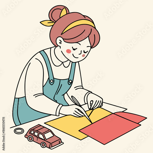 Young girl happily crafting with paper and toys