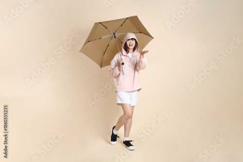 20s Asian woman in pink UV jacket