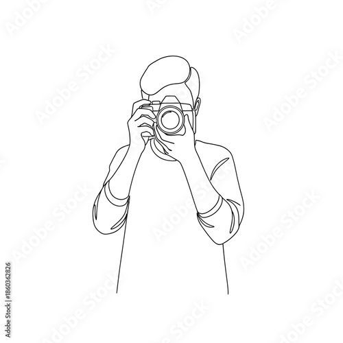 a person holding a camera and taking a photo