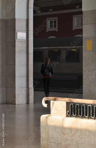 Female passenger in the entrance hall of the train station in Lisbon, Portugal