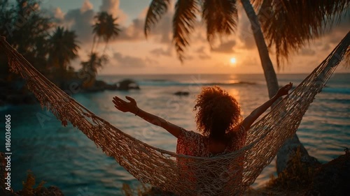 Woman Relaxing in Hammock at Sunset by Ocean