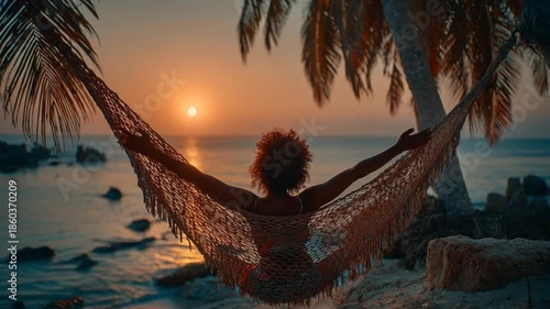 Woman Relaxing in Hammock at Sunset by the Beach
