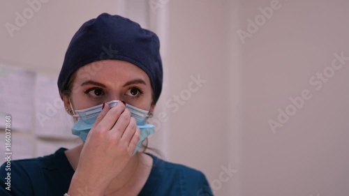 Female surgeon assisting during veterinary operation