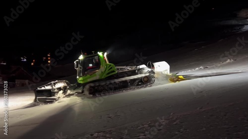 Wallpaper Mural At night snowcat removes excess snow from its path, illuminating it spotlights Torontodigital.ca