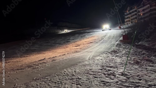 Wallpaper Mural Snow groomer moves down the ski slope, compacting the snow beneath it Torontodigital.ca