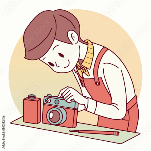 Young boy fixing vintage camera with tools