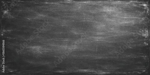 A dark vintage chalkboard texture with a black and white grunge pattern on an old gray concrete wall surface provides a blank textured backdrop for a dirty industrial frame design