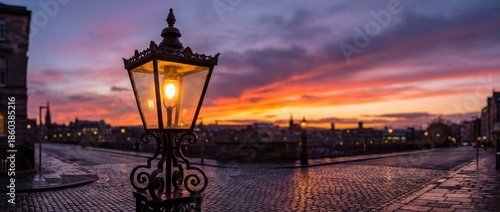 A captivating street scene unfolds at dusk, where an antique lantern illuminates a cobblestone road, under a vibrant, painted sky.