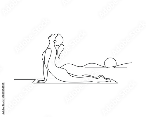 Woman doing cobra pose in yoga