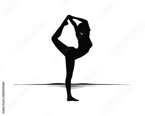 Silhouette of a woman in a yoga dancer pose standing on one leg