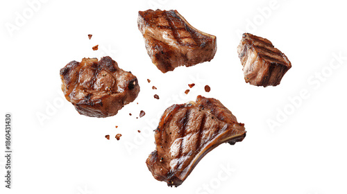Grilled meat pieces with charred grill marks floating against a clean white background. the juicy texture and mouthwatering appeal. ideal for culinary or food-related projects