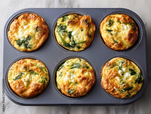 Savory spinach and cheese muffins baked in a muffin tin Golden egg muffin