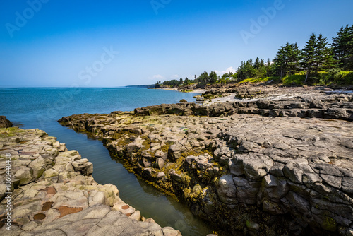 Rocky rugged coast of the Bay of Fundy at the Black Rock Lighthouse on the western side of Nova Scotis Canada