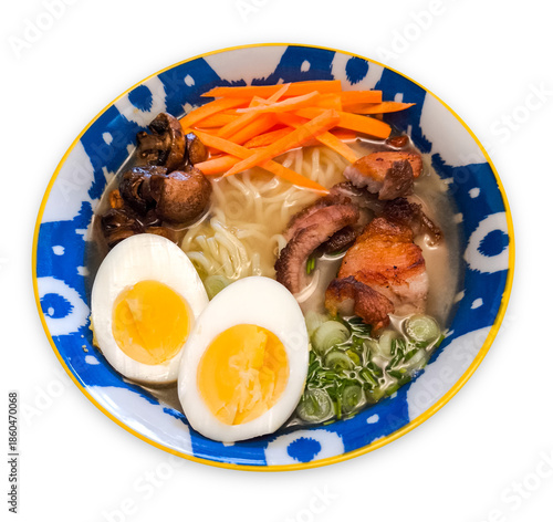 Traditional japanese ramen noodle soup with pork, soft-boiled egg, and assorted fresh vegetables