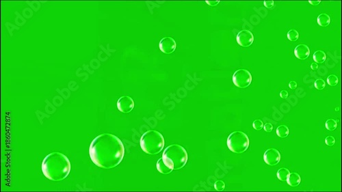 Soap bubbles floating animation | transparent shiny bubble effect with soft motion isolated on green screen background
